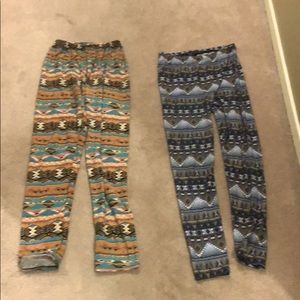 Two pair of Aztec pattern leggings.
